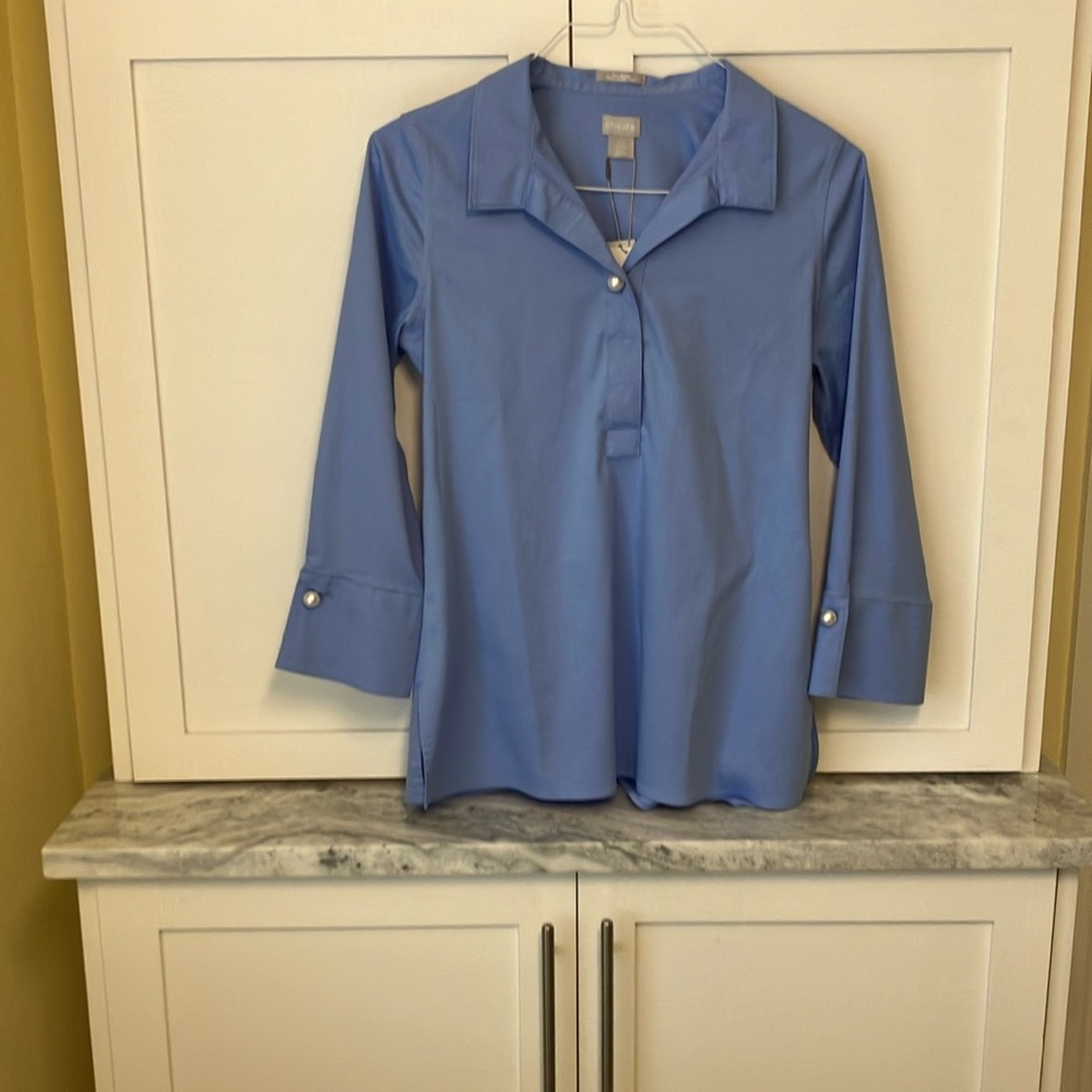 NWT - Chico’s pearl button tunic with 3/4 sleeve. Color: Blue Veil.